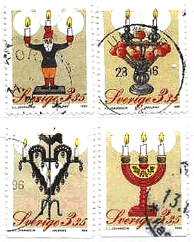 クリスマス用のキャンドル（スウェーデン,1996年）サンタクロースの燭台、リンゴの燭台、練鉄の燭台、３本枝型燭台（三位一体を象徴）